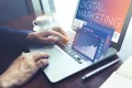 digital marketing for manufacturers concept, man working on laptop in a cafe