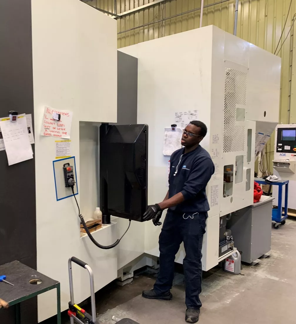 Media Name: an_ele_machinist_programming_the_kitamura_hx500ig.jpg