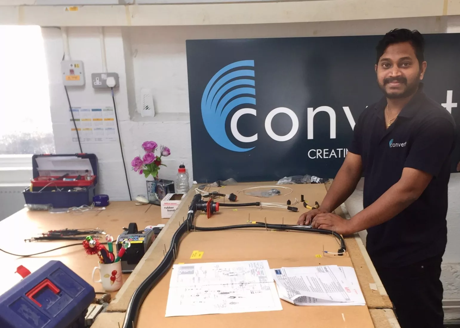 Media Name: converts_pandi_karuppiah_chinnadurai_working_on_the_cable_assemblies_for_mit.jpg