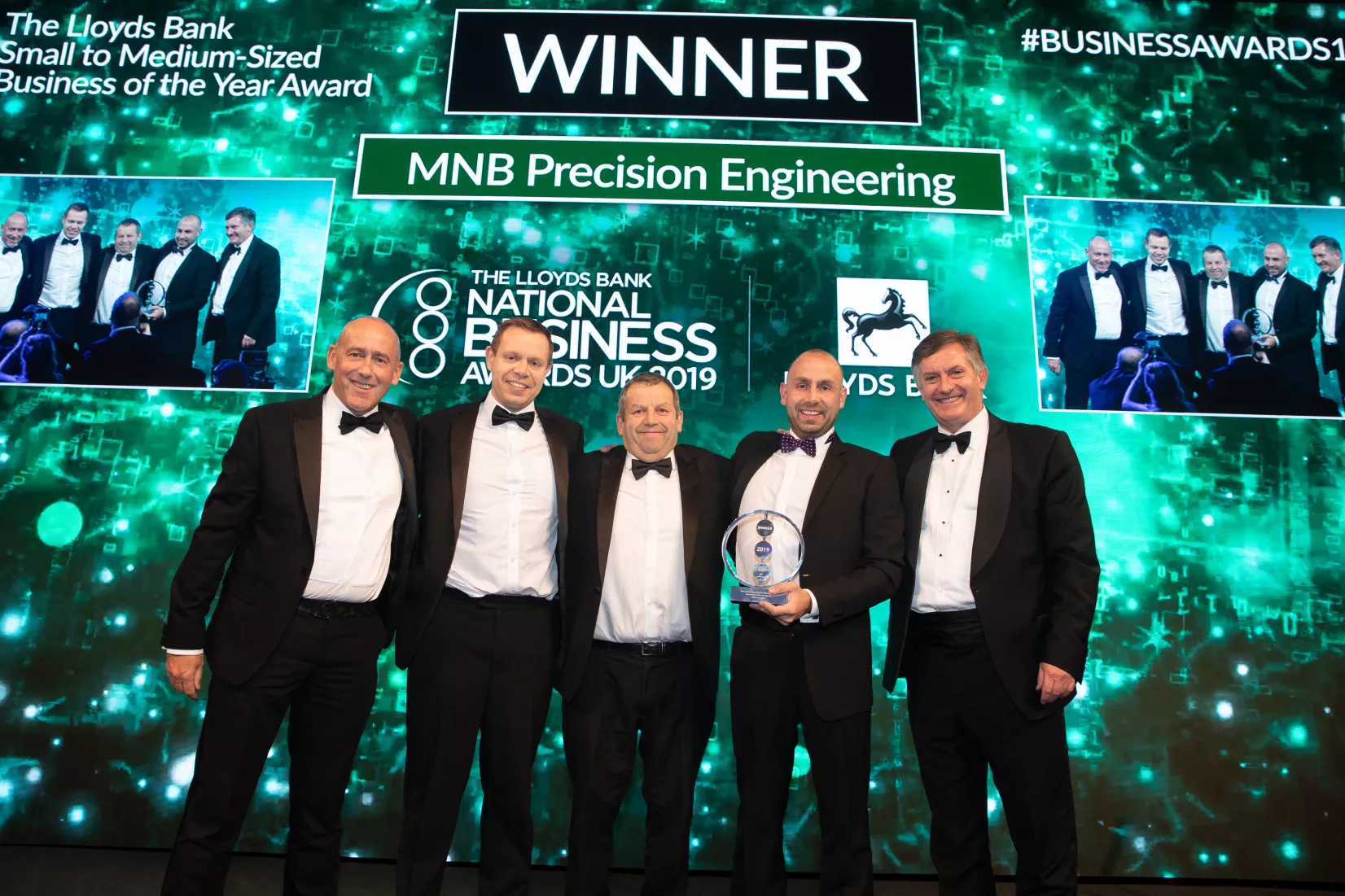 Media Name: mnb_team_with_their_award.jpg
