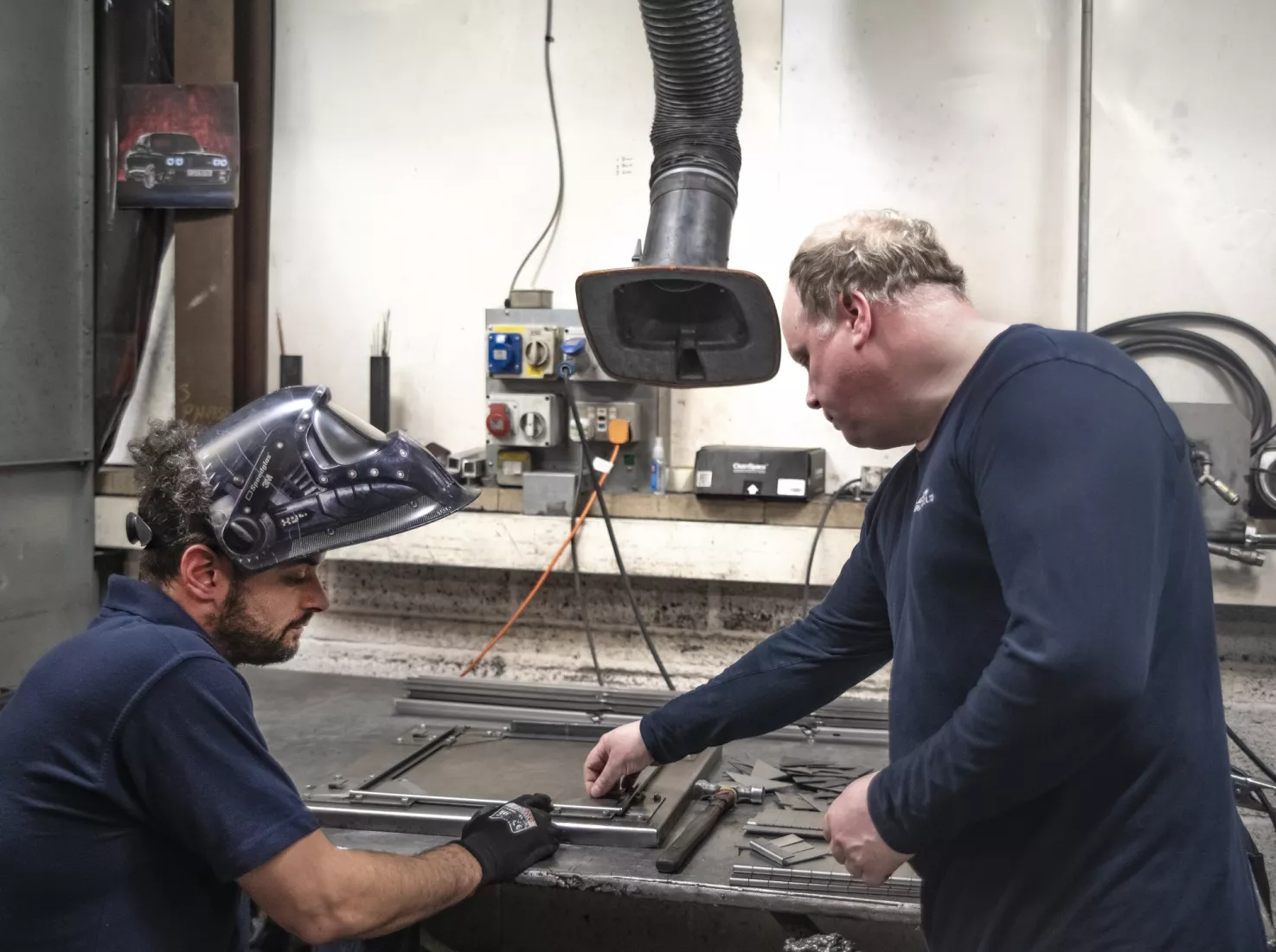 Media Name: team_in_from_of_machinery_1.jpg
