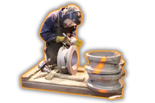 This is an image of a person working on sand castings - a service supplied by Qimtek Supplier Members