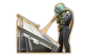 This is an image of person powder coating a steel component - a typical service provided by Qimtek supplier members