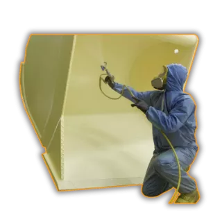 This is an image a man spray painting a tractor - a typical service provided by Qimtek members