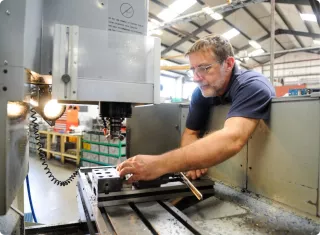 This is an image of Warren Services in their factory - a long-term members of Qimtek
