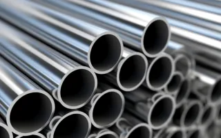 Stacked steel tubes ready for tube laser cutting, showing round metal tube stock used for pipe laser cutting