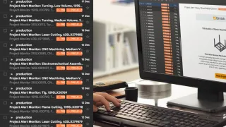 Qimtek Project Alert monitor showing live manufacturing projects and email notifications while a supplier reviews project details on screen